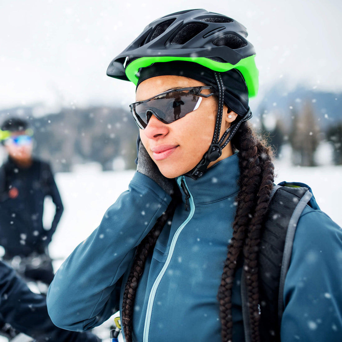Woman using a protective style to mountain bike in cold weather 