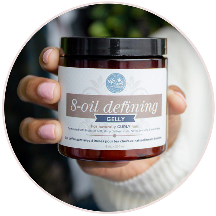 Woman holding the Up North Naturals 8-oil Defining Gelly