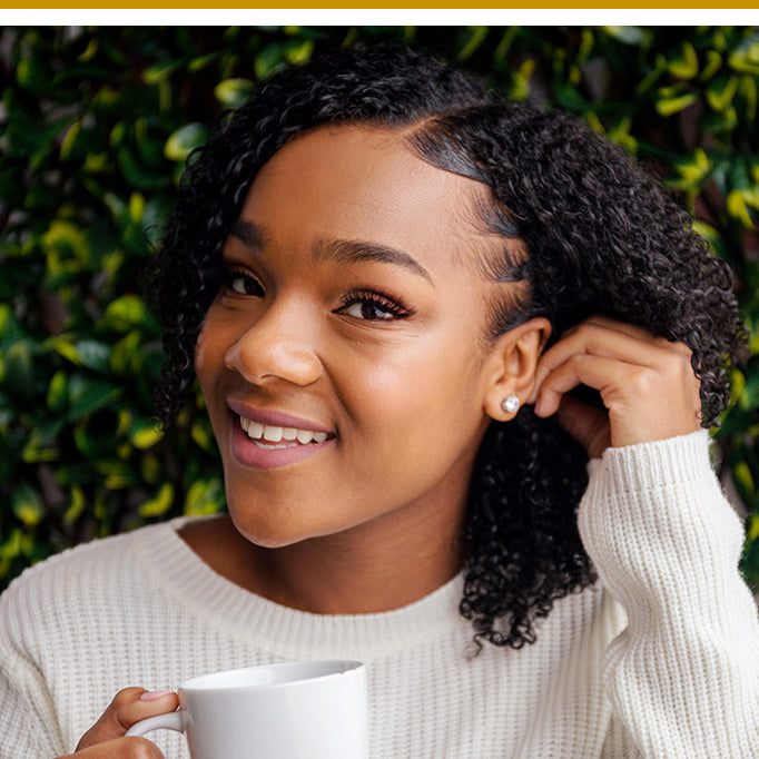 Woman with naturally curly hair with styled edges