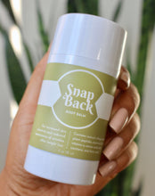 Load image into Gallery viewer, Woman holding snap back body balm